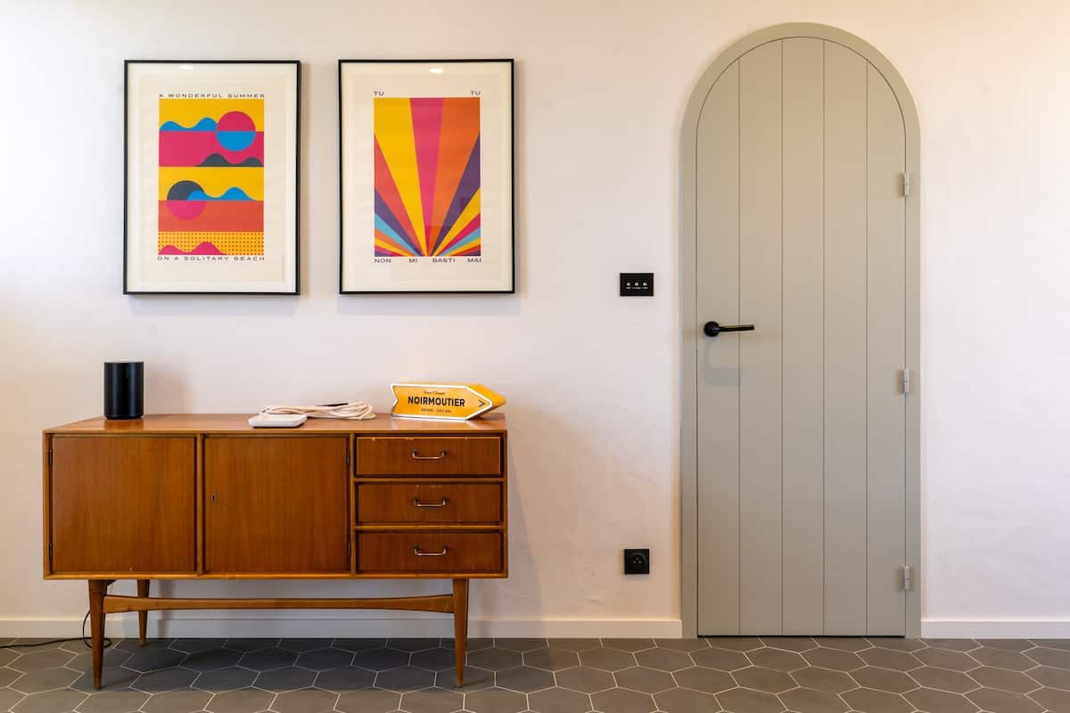 Ground-floor entry, arched door and sideboard